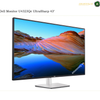 Dell U4323QE front view 4K IPS monitor. Dell monitor U43233Qe UltraSharp 43-inch display shown at an angle on a white background, featuring a colorful desert landscape wallpaper on the screen and a silver stand.