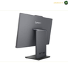 Lenovo ThinkCentre neo 50a 24 Gen 5 Luna Grey All-in-One PC.A Lenovo all-in-one desktop computer shown from a three-quarters rear angle, featuring a dark gray matte finish and a built-in tower on the stand, set against a plain white background.