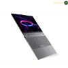 Lenovo Yoga 7 convertible 2-in-1 laptop design | 83TC009WAK. A dark gray convertible laptop shown open at an angle, displaying a colorful screen with a neon ring graphic. The laptop features a sleek keyboard and a large trackpad on a clean white background.