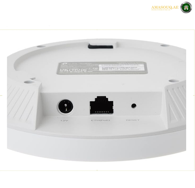 TP-Link EAP650 AX3000 access point with 574 Mbps 2.4 GHz and 2402 Mbps 5 GHz wireless speeds.  Close-up of the back of a white round electronic device, showing ports and a label, on a white background.