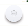 TP-Link EAP653 UR dual-band Wi-Fi 6 access point with 574 Mbps 2.4 GHz and 2402 Mbps 5 GHz speeds. A white TP-Link wireless access point with a circular design, featuring a small blue indicator light at the bottom and the TP-Link logo in the center, set against a plain white background.