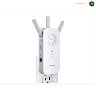 TP-Link RE450 AC1750 Dual-Band Wi-Fi Range Extender. TP-Link wireless router power adapter with two external antennas, shown plugged into a wall outlet against a white background.